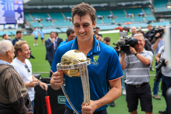 Pat Cummins with the World Cup trophy. 