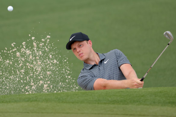 Cameron Davis of Australia plays a shot from a bunker.