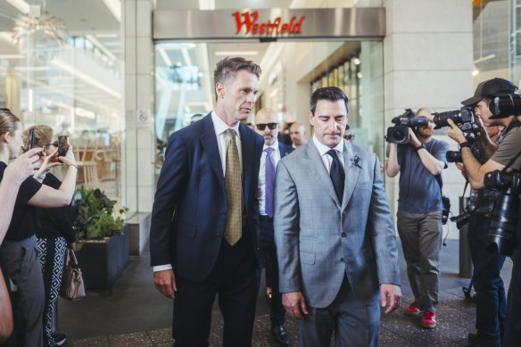 NSW Premier Chris Minns walks through Westfield Bondi junction with Elliott Rusanow, the chief executive of Westfield owner Scentre Group.