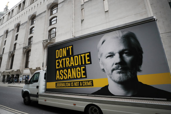 A truck with a billboard of Julian Assange arrives at the Old Bailey court in London during his extradition hearing.