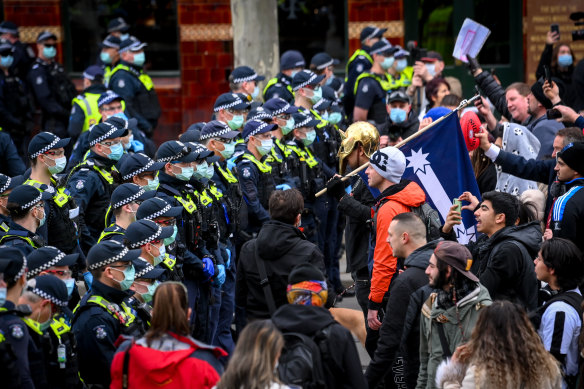Police and protesters come face to face in Melbourne on Saturday.