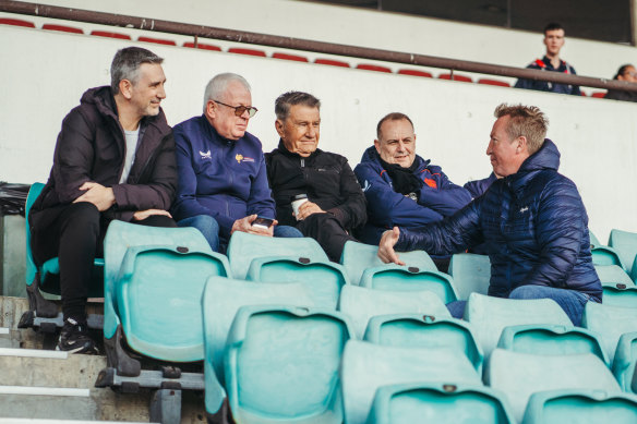 Roosters boss Nick Politis (third from left) and coach Trent Robinson (right) in the stands for Nawaqanitawase’s club debut.