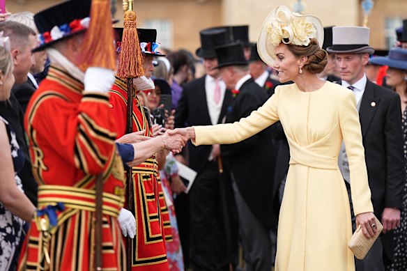 Princess Catherine in an Emilia Wickstead dress and Philip Treacy hat at Buckingham Palace for a garden party.