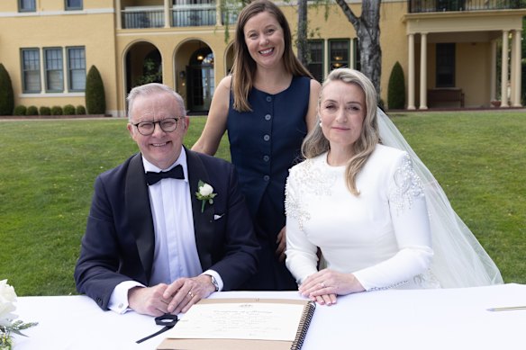 The couple signing their marriage certificate with a celebrant from Haydon’s NSW Central Coast community.