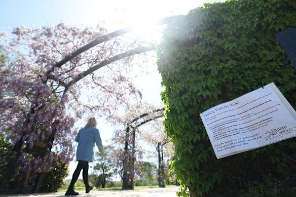 A note asks people using Wisteria walk at Eltham Cemetery to respect mourners.