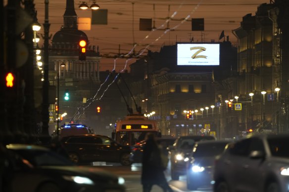 The sign Z and worlds reading “we don’t leave ours” is seen over Nevsky Prospect in St. Petersburg, Russia, on March 5.
