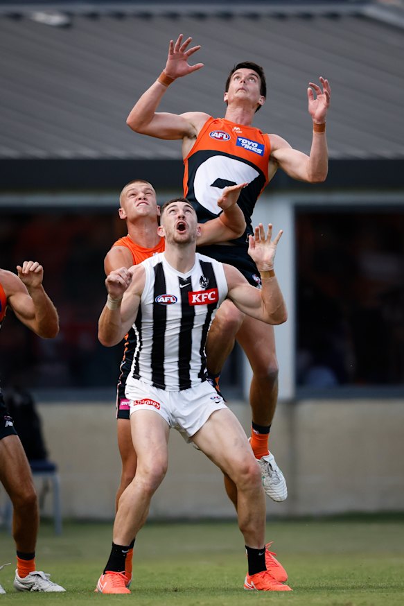 GWS defender Sam Taylor flies high for a mark.