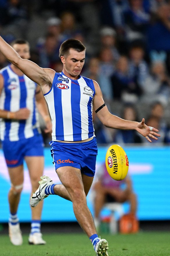 Colby McKercher of the Kangaroos kicks the ball.