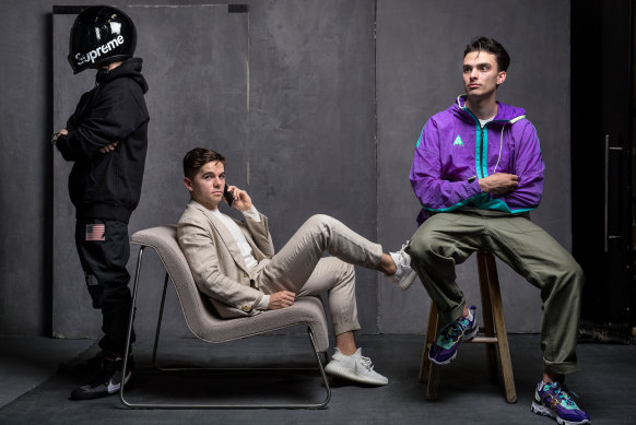 From left: Nathan Tran wears Nike X Off White Virgil Abloh Blazers sneakers in Grim Reaper black, with Supreme X Simpson Bandit helmet, Supreme X Comme Des Garcons "Split
Box" logo hoodie, Supreme X The North Face Goretex pants. Fraser Lack wears Adidas Yeezy Boost 350 sneakers with P Johnson custom-tailored linen suit and Solid Homme silk sweater. Patrick Boyle wears 1of1 ACG Nike React Element 87 sneakers handmade by bespokeIND, with Slow fatigue pants and Nike ACG jacket
from Up There store.