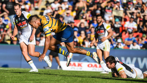 Mostly anonymous: Jarryd Hayne stumbles after a last-ditch tackle by James Maloney.