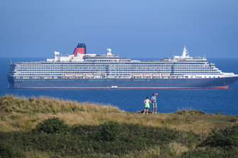 Cruise ship Queen Victoria anchored in the English Channel off the Dorset coast as the industry remains at a standstill.