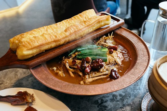 Fish head stew with youtiao (Chinese fried bread).