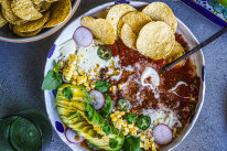 Taco soup with all the toppings.