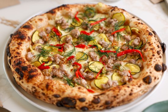 Pork and fennel sausage with fior di latte, zuni pickle and confit garlic.