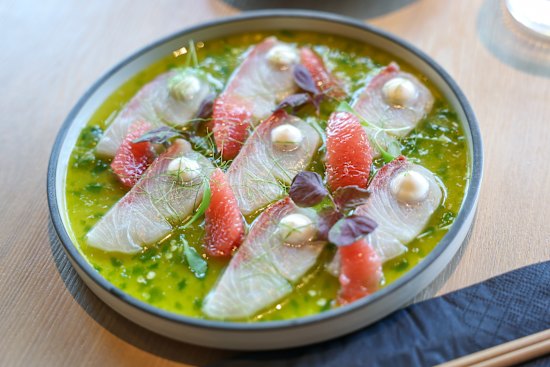 Koi Toy’s kingfish sashimi is dressed with pink grapefruit, coconut cream and yuzu kosho.