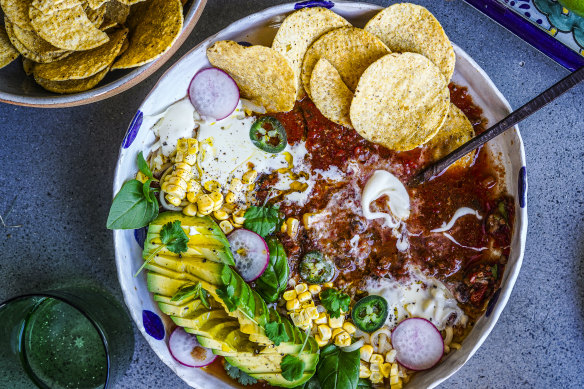 Taco soup with all the toppings.