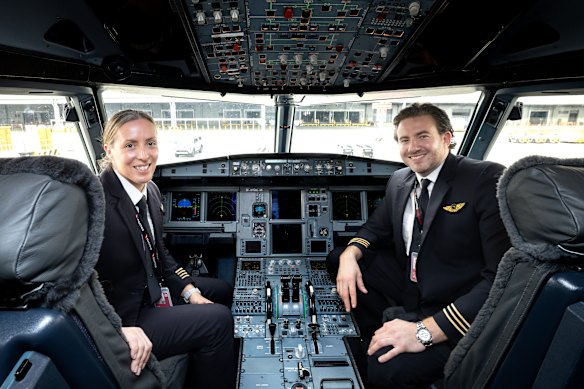 Captain Taryn Lloyd and first officer Jay Bayliss on the refitted A321 at Western Sydney International Airport.