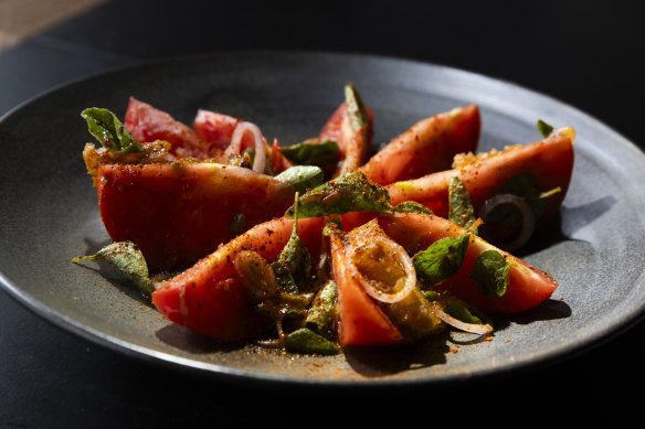 Heirloom tomatoes with pine nuts and oregano.