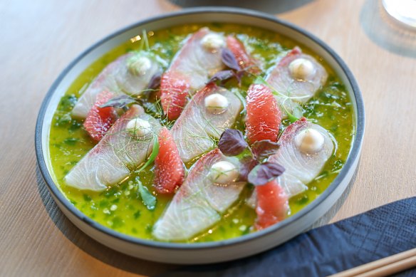 Koi Toy’s kingfish sashimi is dressed with pink grapefruit, coconut cream and yuzu kosho.