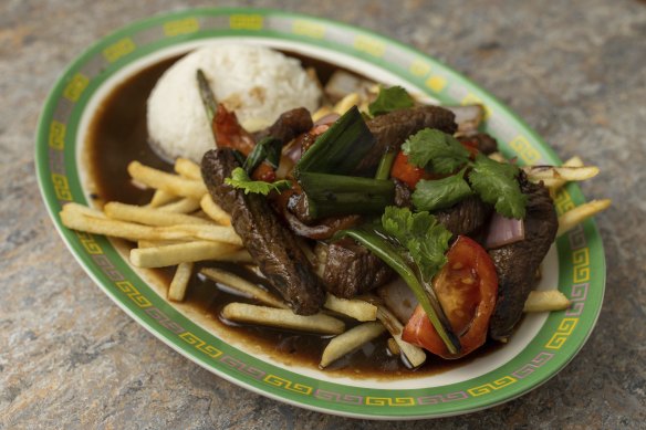 Lomo saltado is beef stir-fried with Peruvian chilli and served with fries and rice.