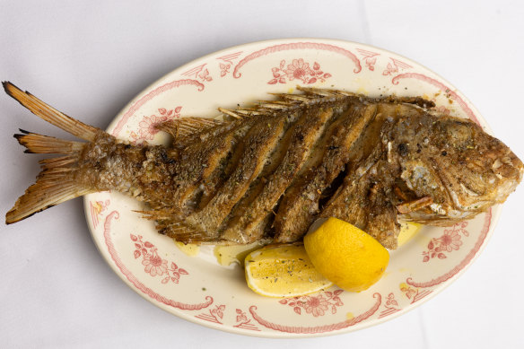 Whole fish of the day, grilled and served with lemon.