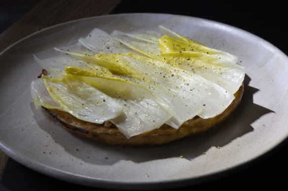 Chickpea pancake with witlof, hazelnut and preserved mandarin.