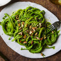 Peruvian-inspired green spaghetti with smoked almonds.