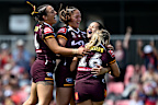 Broncos players celebrate defeating the Warriors in the final round of the regular season.