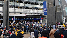 Fans line up outside the MCG.