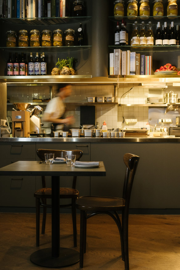 A sleek and moody fitout, with seating over two levels.