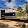 The Airey’s Inlet house is constructed from compressed cement panels and pearlescent-coloured translucent fibre-reinforced plastic.