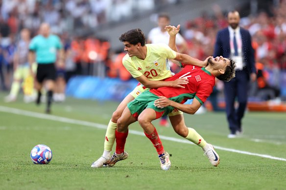 Juanlu Sanchez of  Spain and Abde Ezzalzouli of  Morocco battle for the ball.