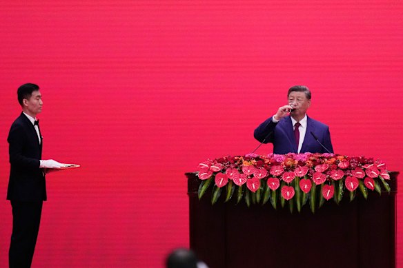 Chinese President Xi Jinping takes a drink at a reception following a military parade to commemorate the 80th anniversary of Japan’s World War II surrender held in front of Tiananmen Gate in Beijing.