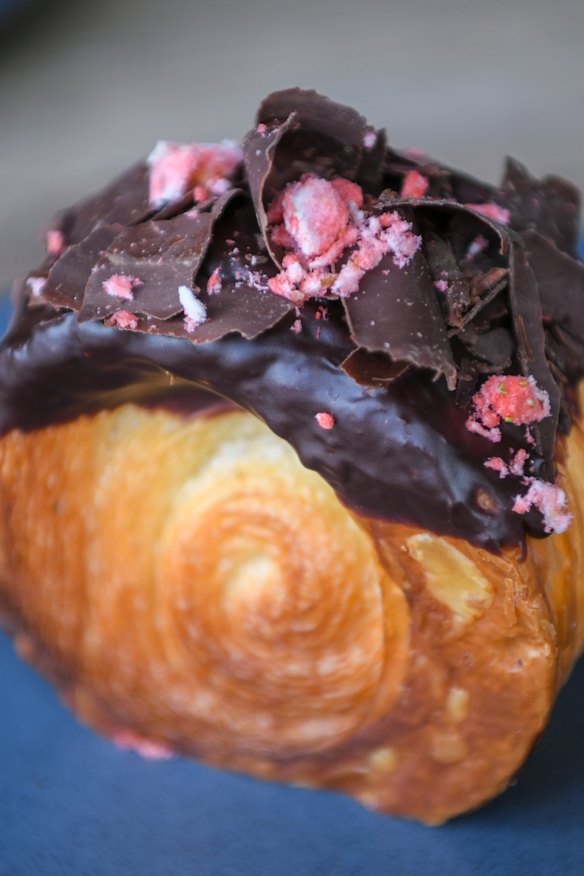 Chocolate mousse croissant wheel topped with chocolate ganache.