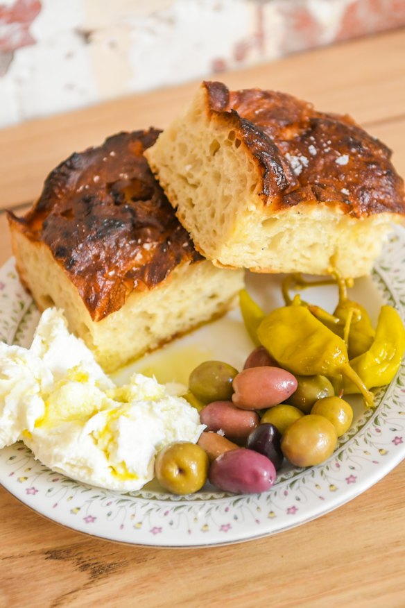 Focaccia served with olives, pickled chilli and torn burrata.