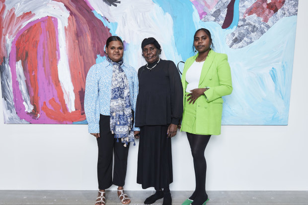 From left, Sally Gabori’s great-granddaughter Tori Juwarnda Wilson-Gabori, daughter Amanda Gabori Dibirdibi and great-granddaughter Narelle Gabori at the Fondation Cartier exhibition in Paris.