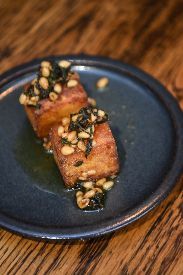 Fried polenta with pine nuts and sage.