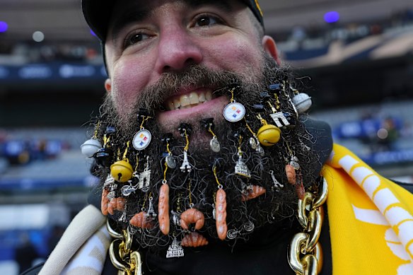 The beard of a Steelers fan is adorned with French related ephemera ahead of an NFL football game between Pittsburgh Steelers and New Orleans Saints in Saint-Denis, outside Paris, Sunday, Oct. 25, 2026.