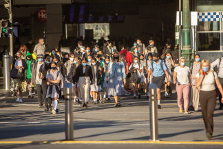 Commuters outside Flinders Street Station.