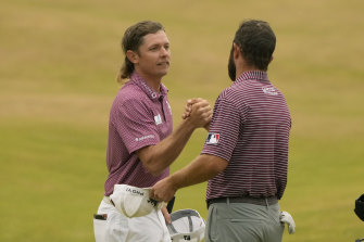 Brisbane’s Cameron Smith (left) shakes hands with American Cameron Young after their final round of the British Open at St  Andrews in Scotland last Sunday.