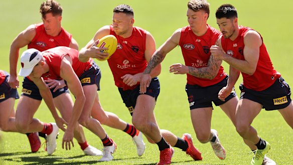 Steven May and his Demons teammates train the day before the grand final.