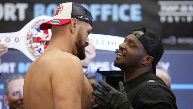 British heavyweight boxers Tyson Fury and Dillian Whyte come face to face at the weigh-in.