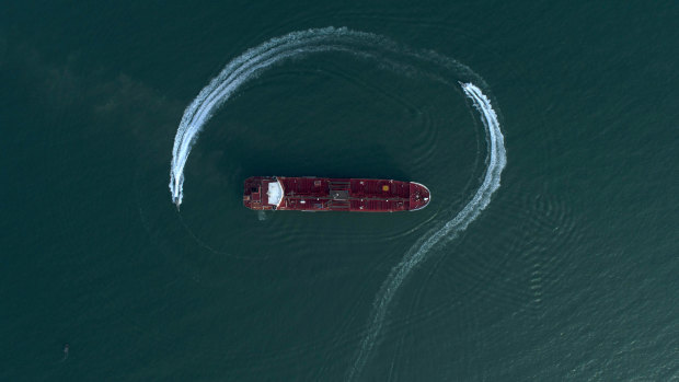 Boats from Iran’s Revolutionary Guard circle the British-flagged oil tanker Stena Impero days after it was seized in the Strait of Hormuz in 2019.