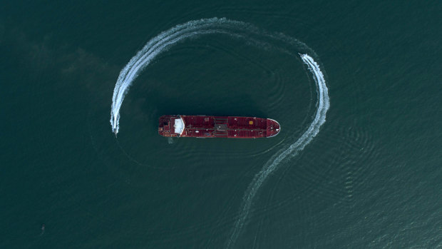 Boats from Iran's Revolutionary Guard circle the British-flagged oil tanker Stena Impero on July 21 in the Iranian port of Bandar Abbas. The ship was seized in the Strait of Hormuz two days earlier.