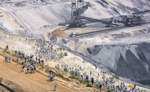 Activists climb into the Garzweiler lignite mine in Germany on June 22 as part of a protest against coal mining.