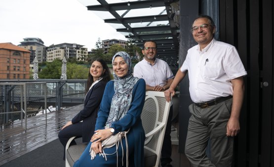 Raneem Emad and Roaa Ahmed, who topped Arabic, with their fathers 