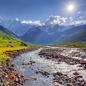 Alpine meadows at the foot of Tetnuldi glacier, Chkhutnieri Pass, Georgia.