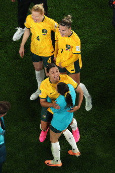 Sam Kerr celebrates with teammates after the win.