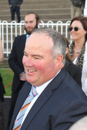 Coming up roses: Trainer Brad Widdup enjoys the win.