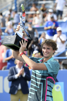 Double up: Alexander Zverev holds aloft the trophy after winning his second Citi Open title.